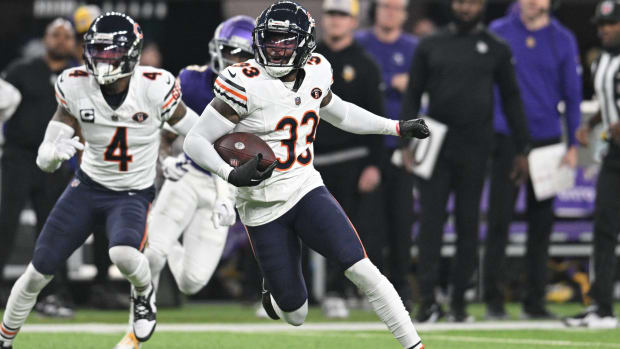 Bears cornerback Jaylon Johnson returns an interception in a game against the Vikings.